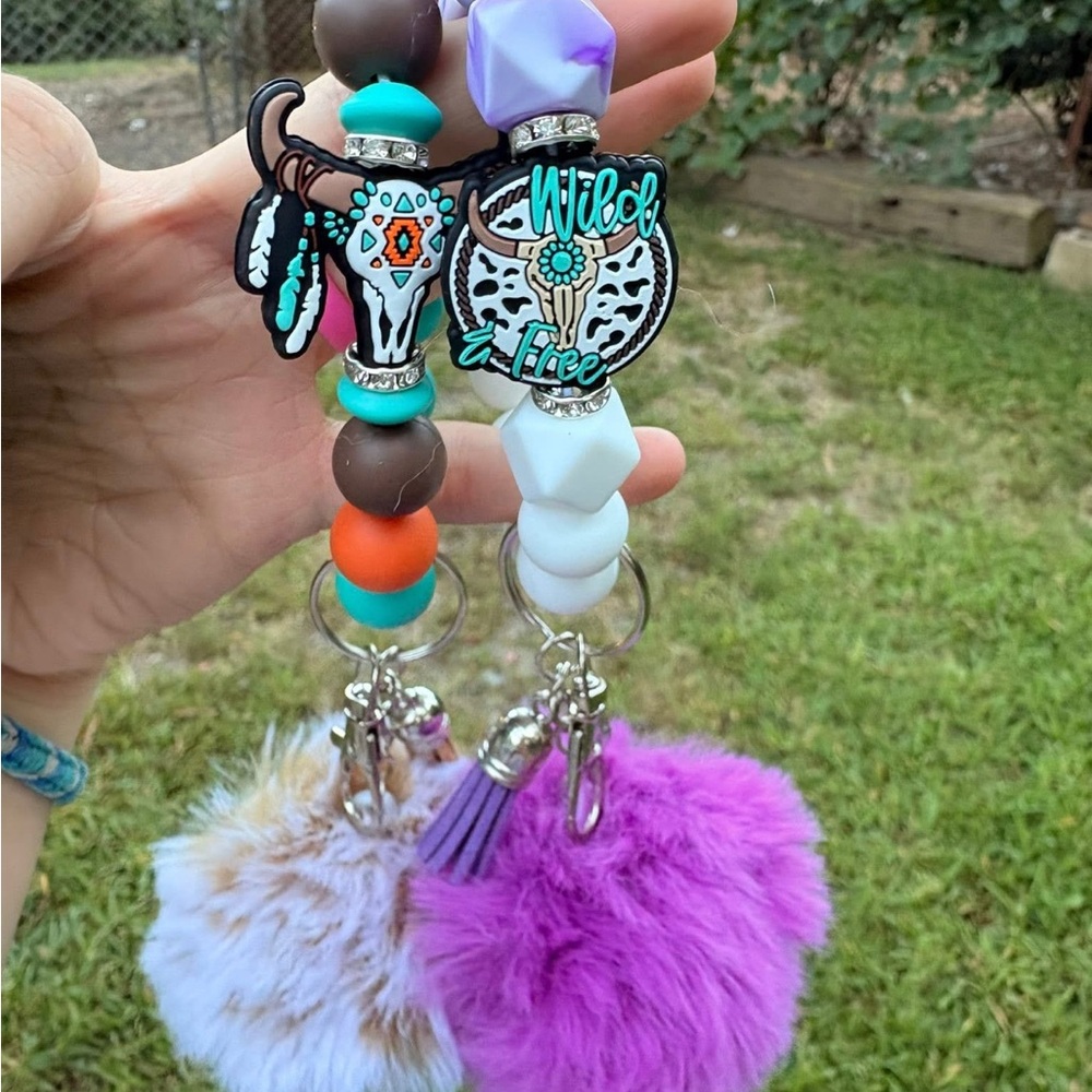 Wild & Free Keychain with Purple and White Pom Poms